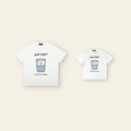 One kids' t-shirt and one adult t-shirt laid side by side
