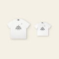 One kids' t-shirt and one adult t-shirt laid side by side