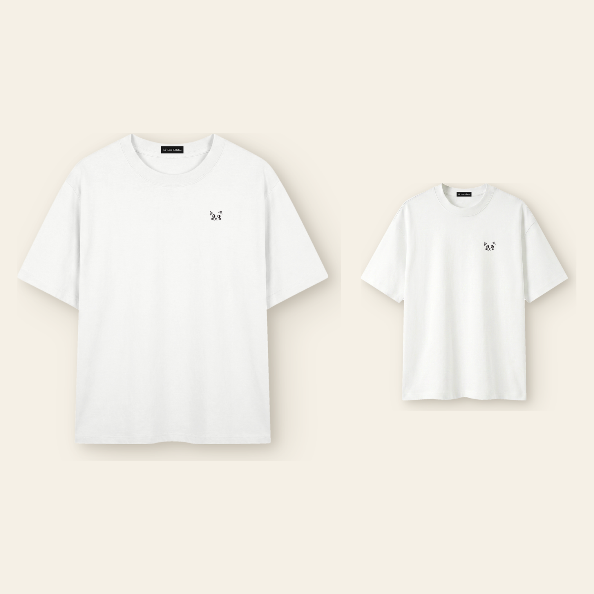 One kids' t-shirt and one adult t-shirt laid side by side