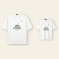 One kids' t-shirt and one adult t-shirt laid side by side