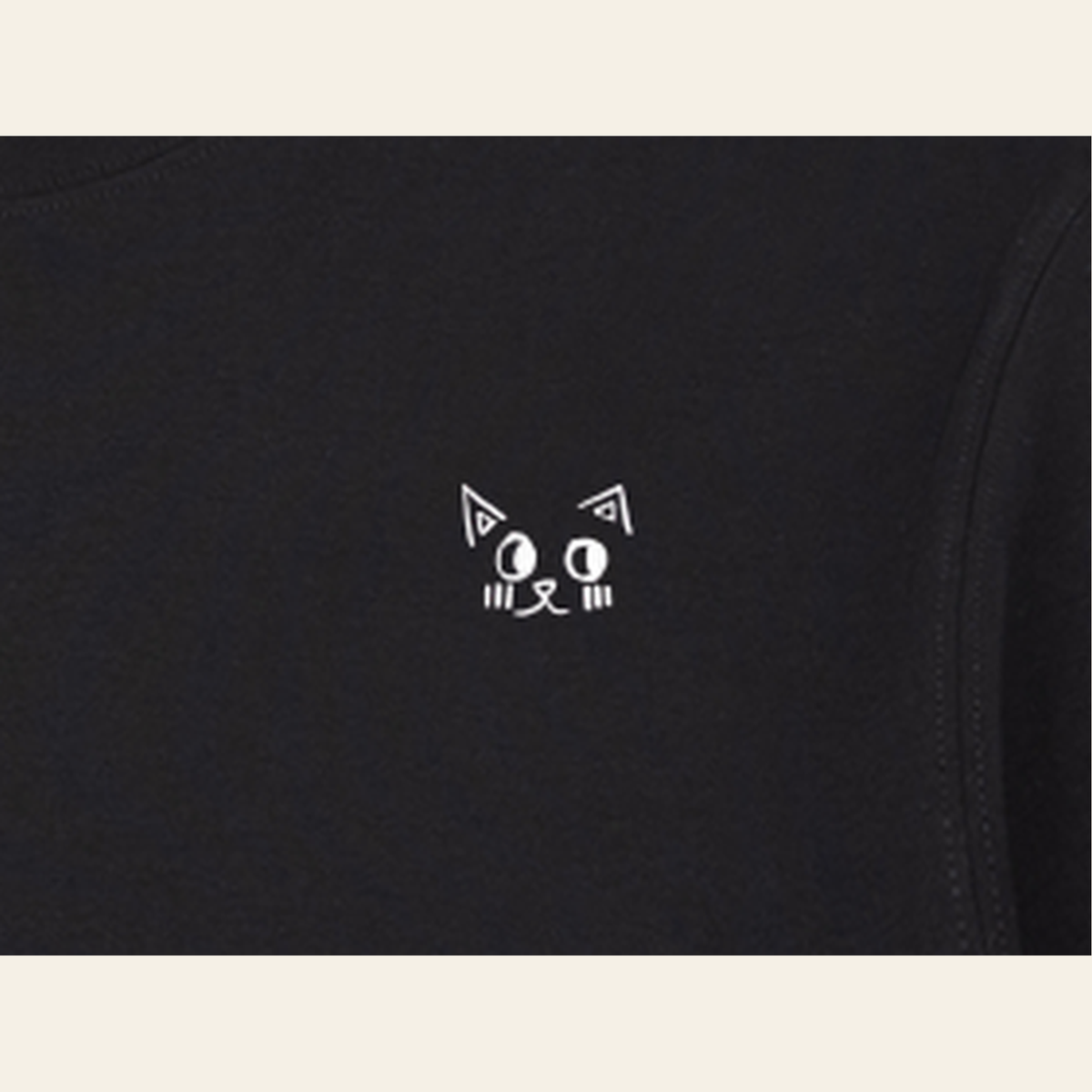 Close-up of the print on the Black adult piece — the kids' piece carries the same design