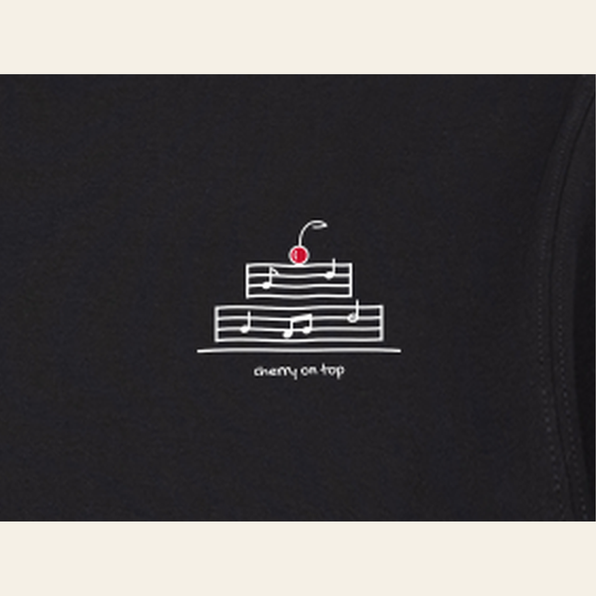 Close-up of the print on the Black adult piece — the kids' piece carries the same design