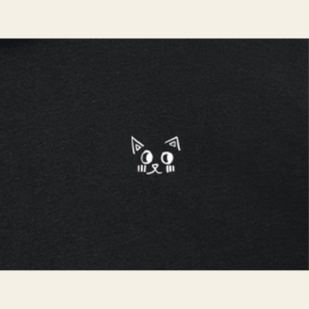 Close-up of the Just Right mark printed on the Black zip hoodie