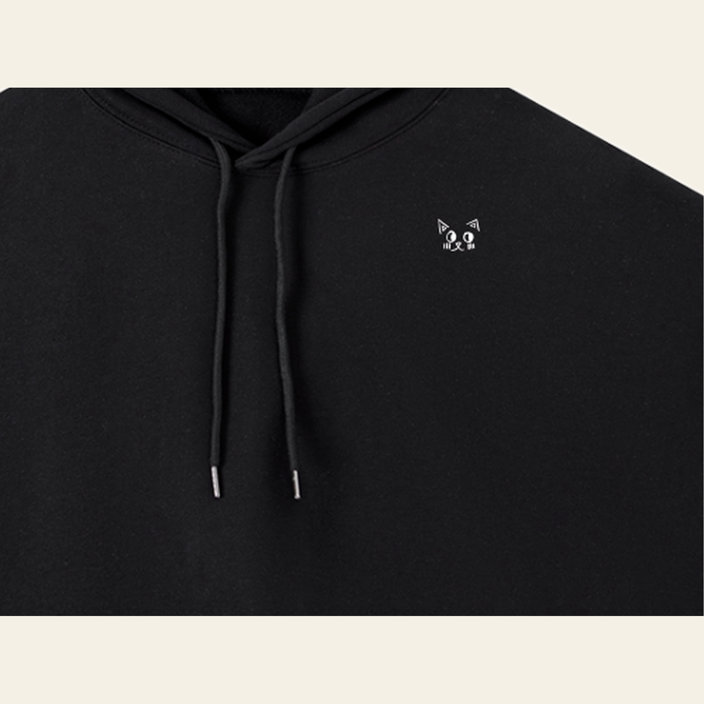 Close-up of the Batce mark printed on the Black hoodie