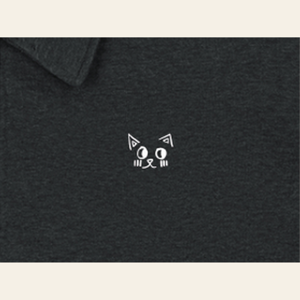 Close-up of the Batce mark printed on the Black quarter-zip