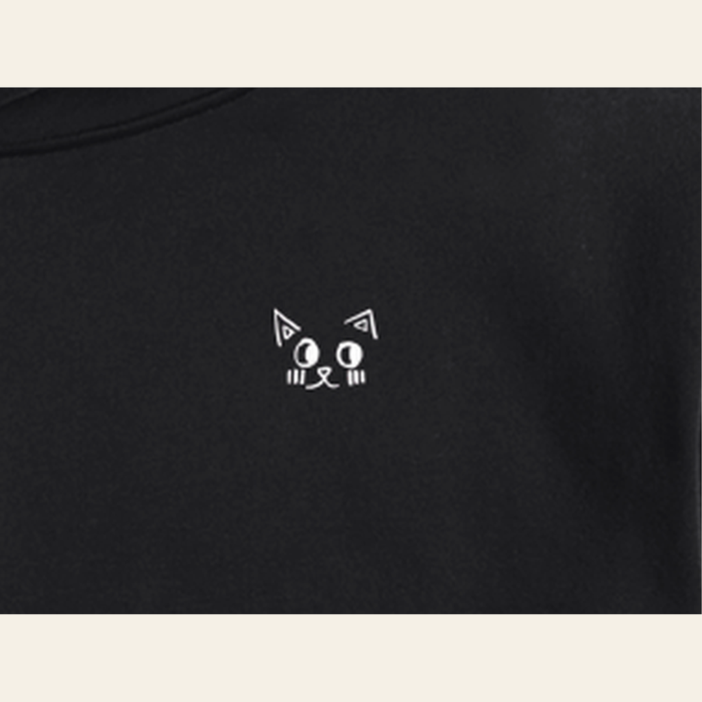 Close-up of the Just Right mark printed on the Black hoodie