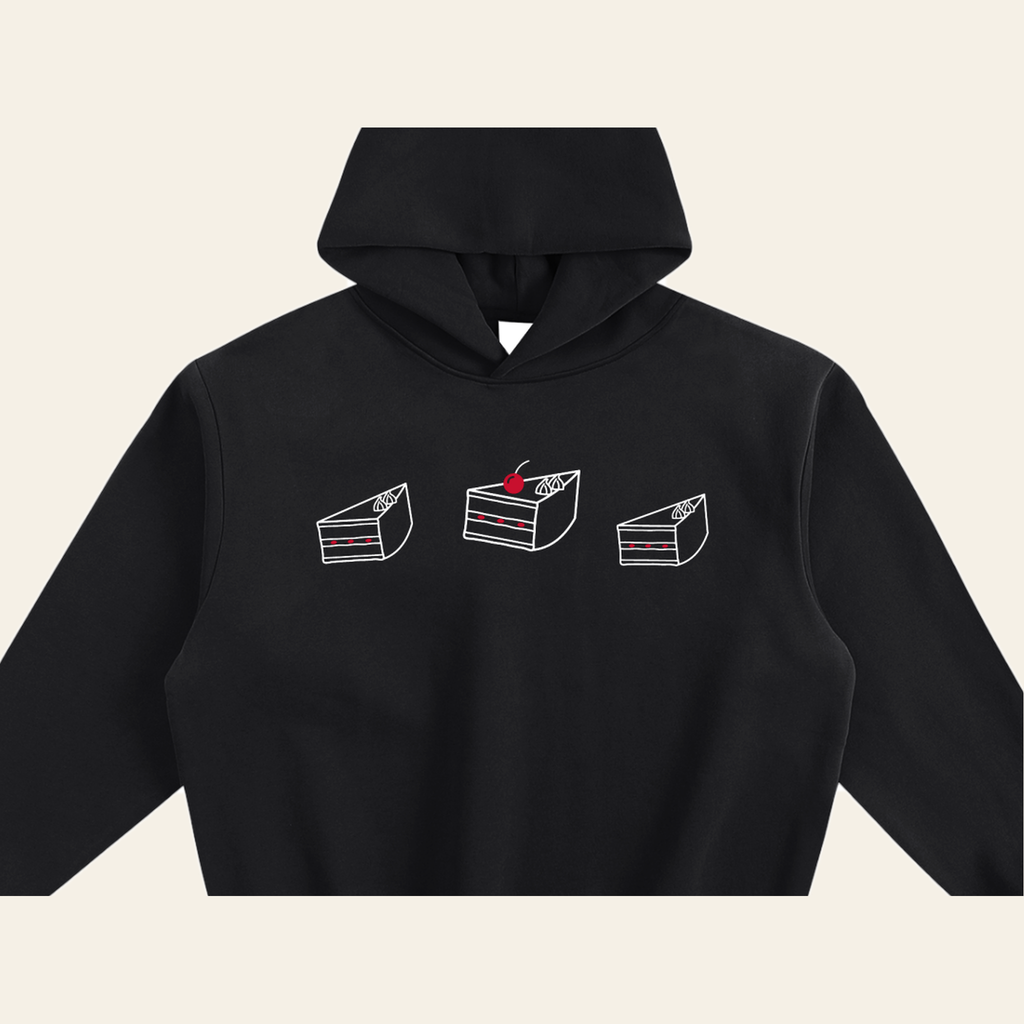Close-up of the Cherry on Top mark printed on the Black hoodie