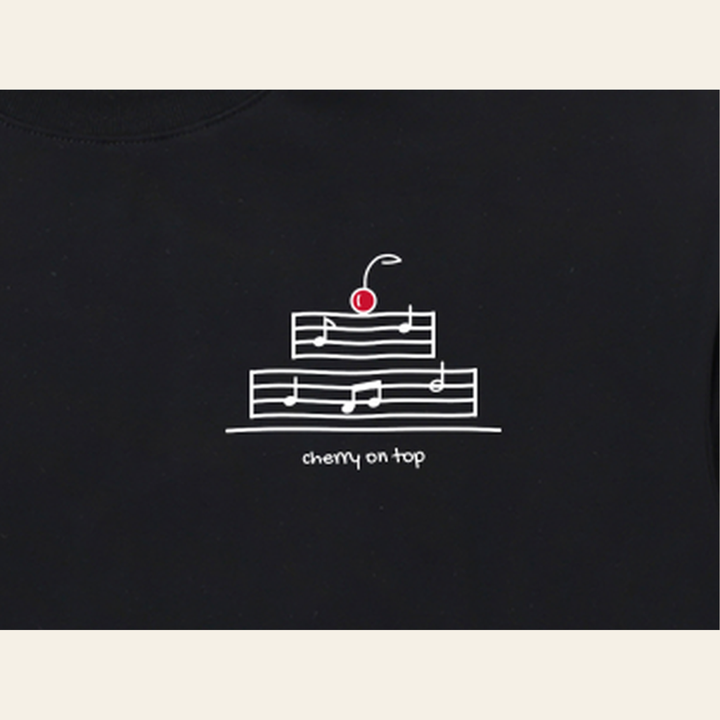 Close-up of the Cherry on Top mark printed on the Black long-sleeve t-shirt