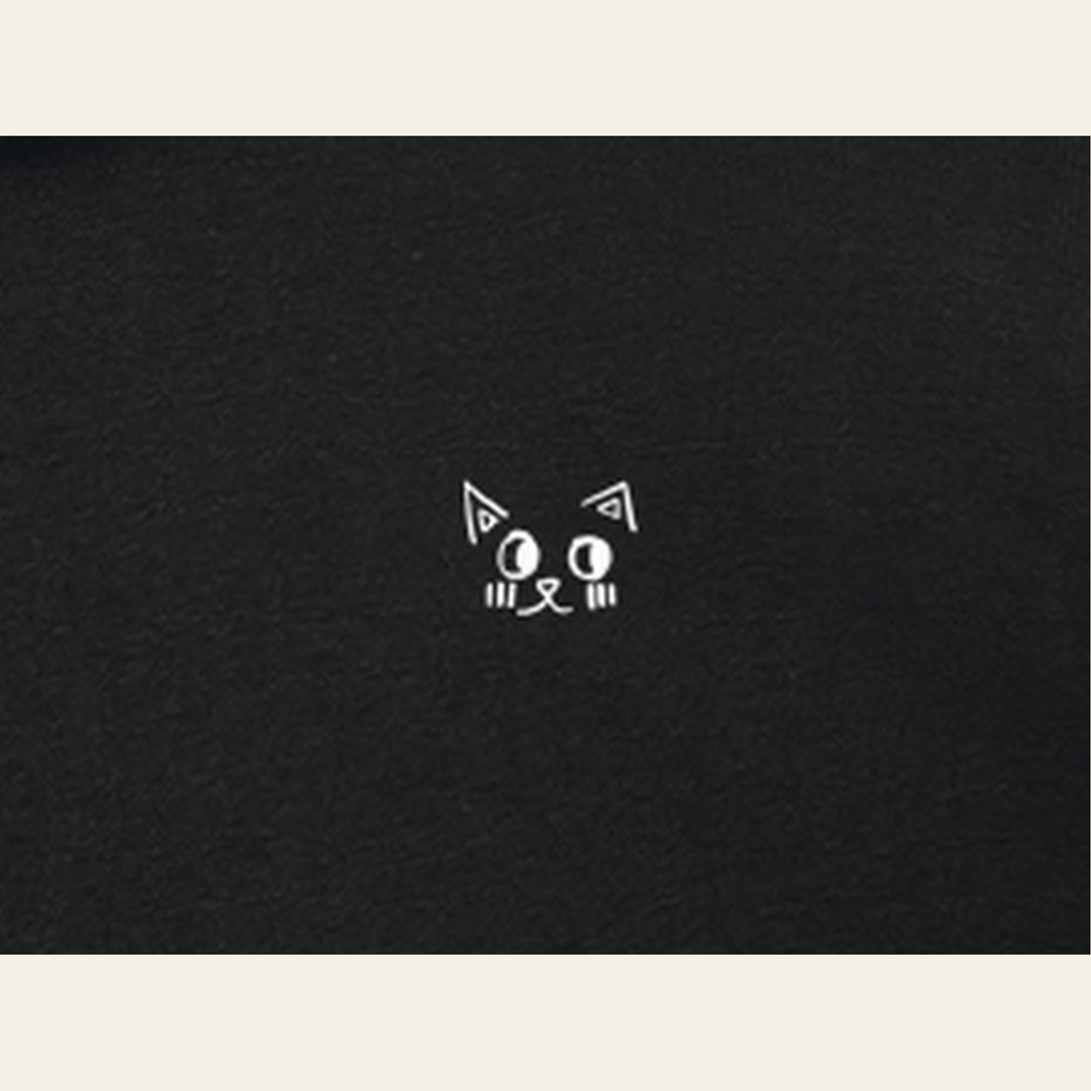 Close-up of the Cherry on Top mark printed on the Black zip hoodie