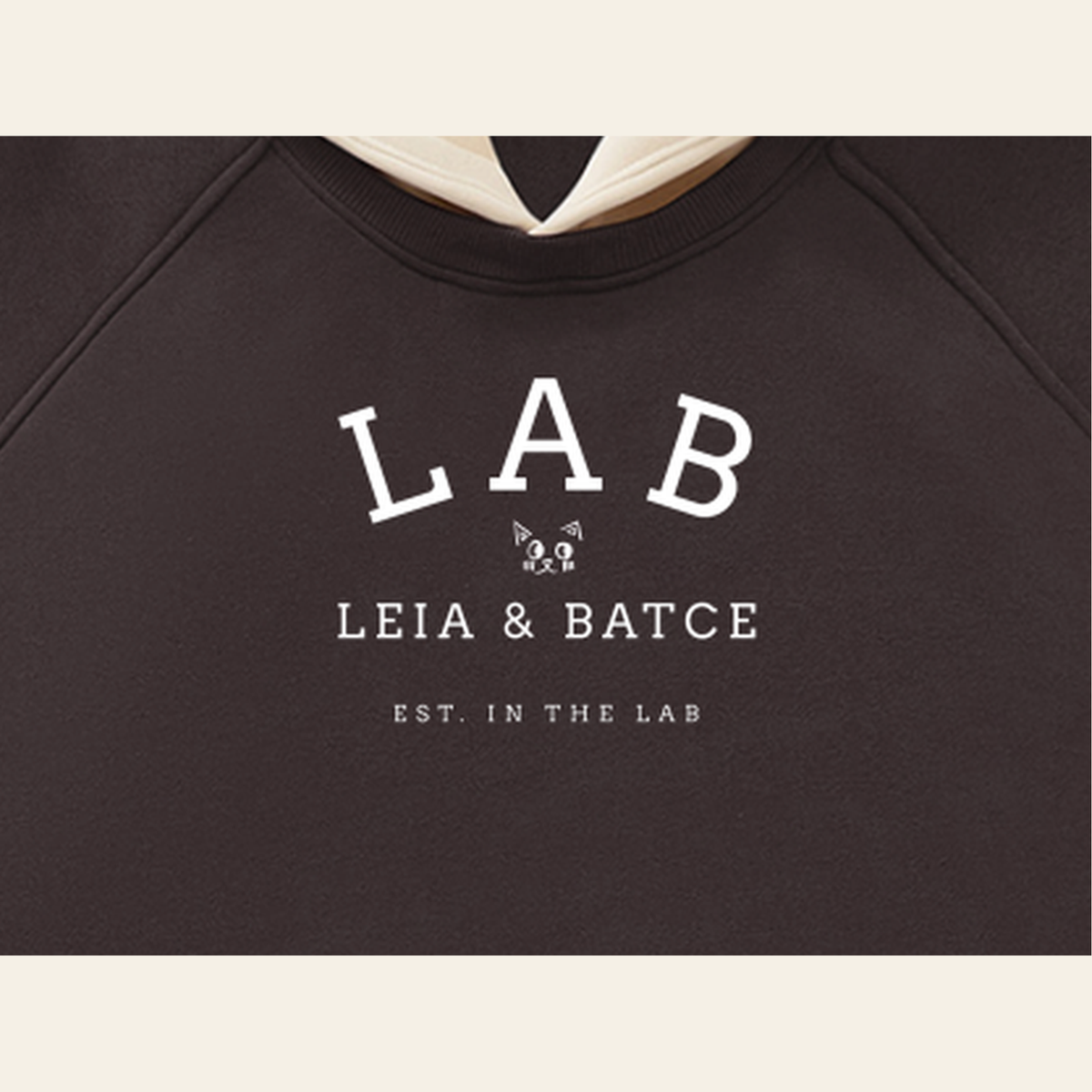 Close-up of the Batce Lab mark printed on the Brown / Peach hoodie