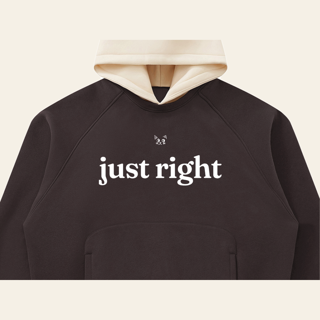 Close-up of the Just Right mark printed on the Brown / Peach hoodie