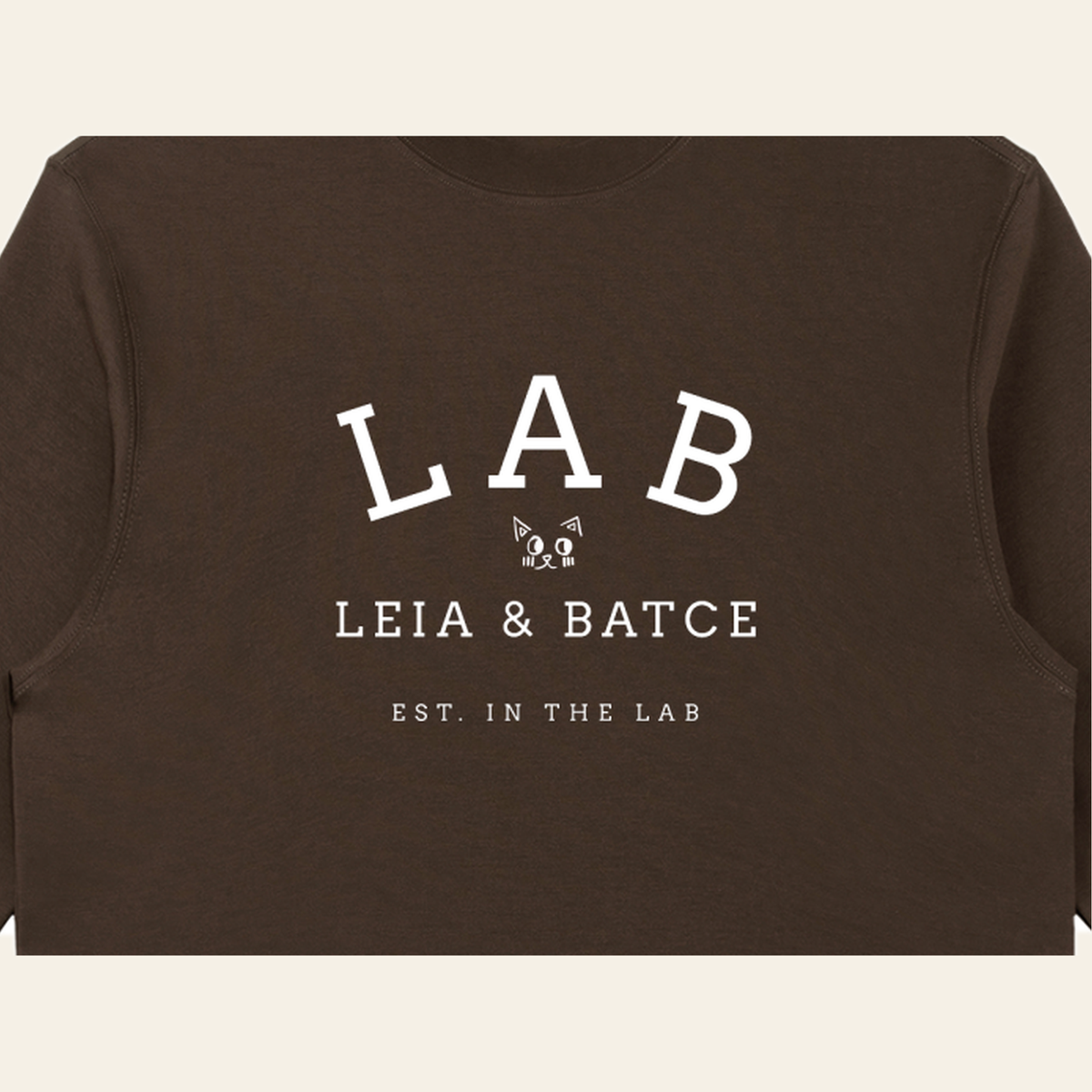 Close-up of the Batce Lab mark printed on the Brown long-sleeve t-shirt