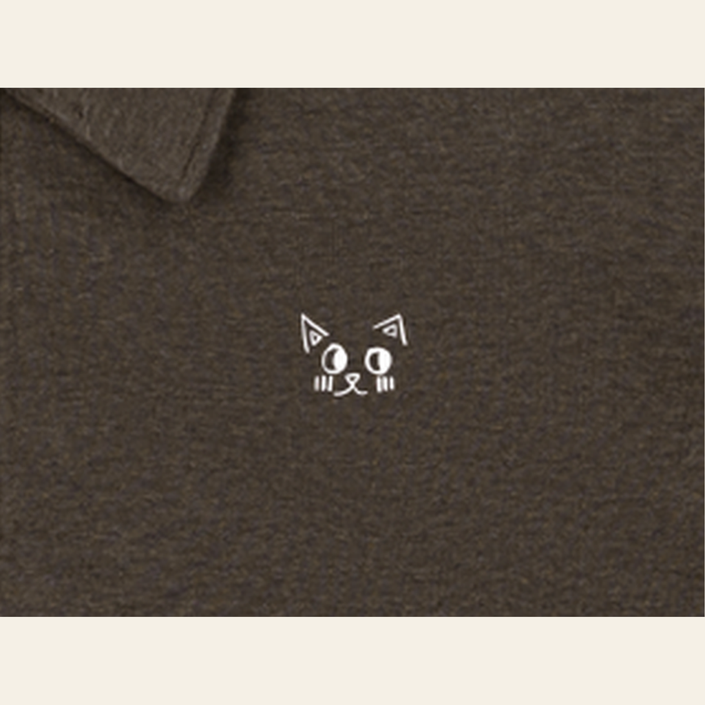 Close-up of the Batce mark printed on the Brown quarter-zip
