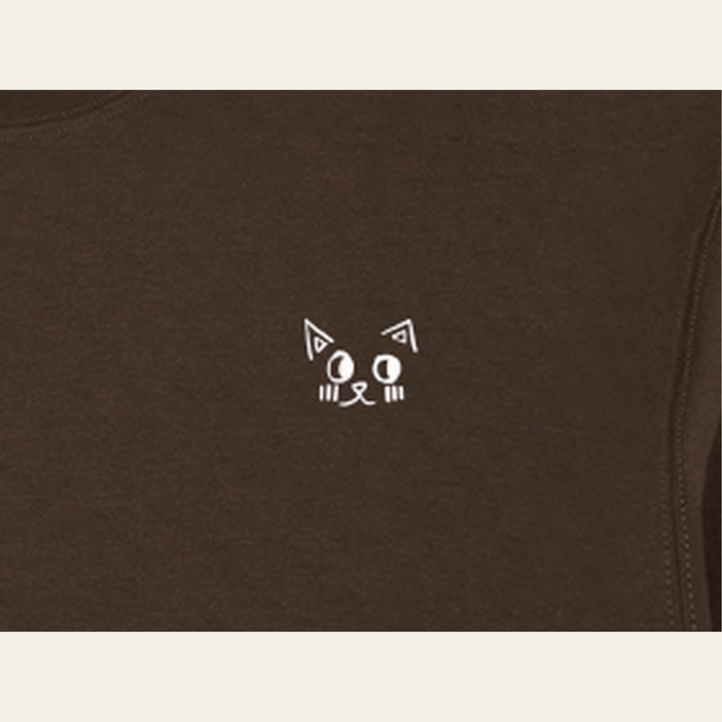 Close-up of the Batce mark printed on the Brown long-sleeve t-shirt