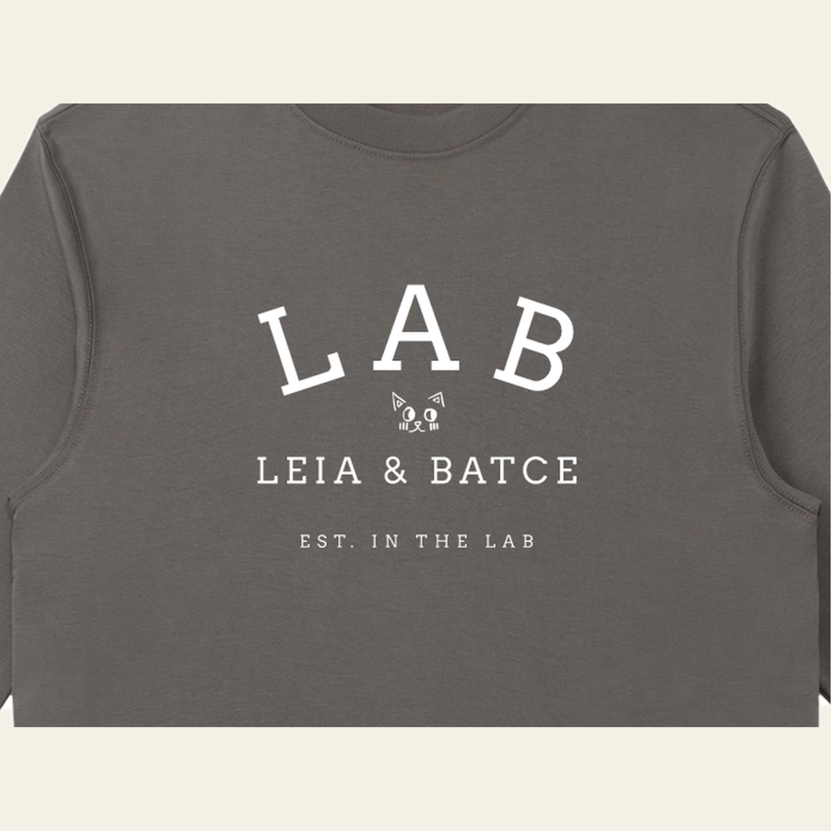 Close-up of the Batce Lab mark printed on the Dark Gray long-sleeve t-shirt