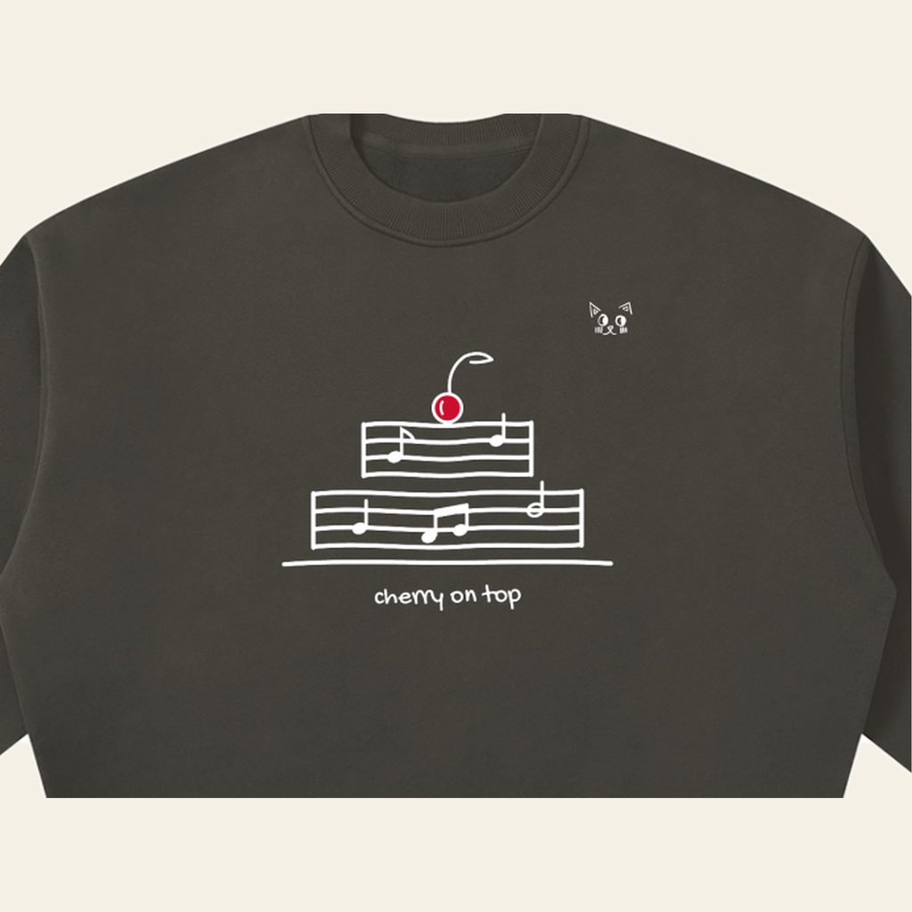 Close-up of the Cherry on Top mark printed on the Dark Gray sweatshirt