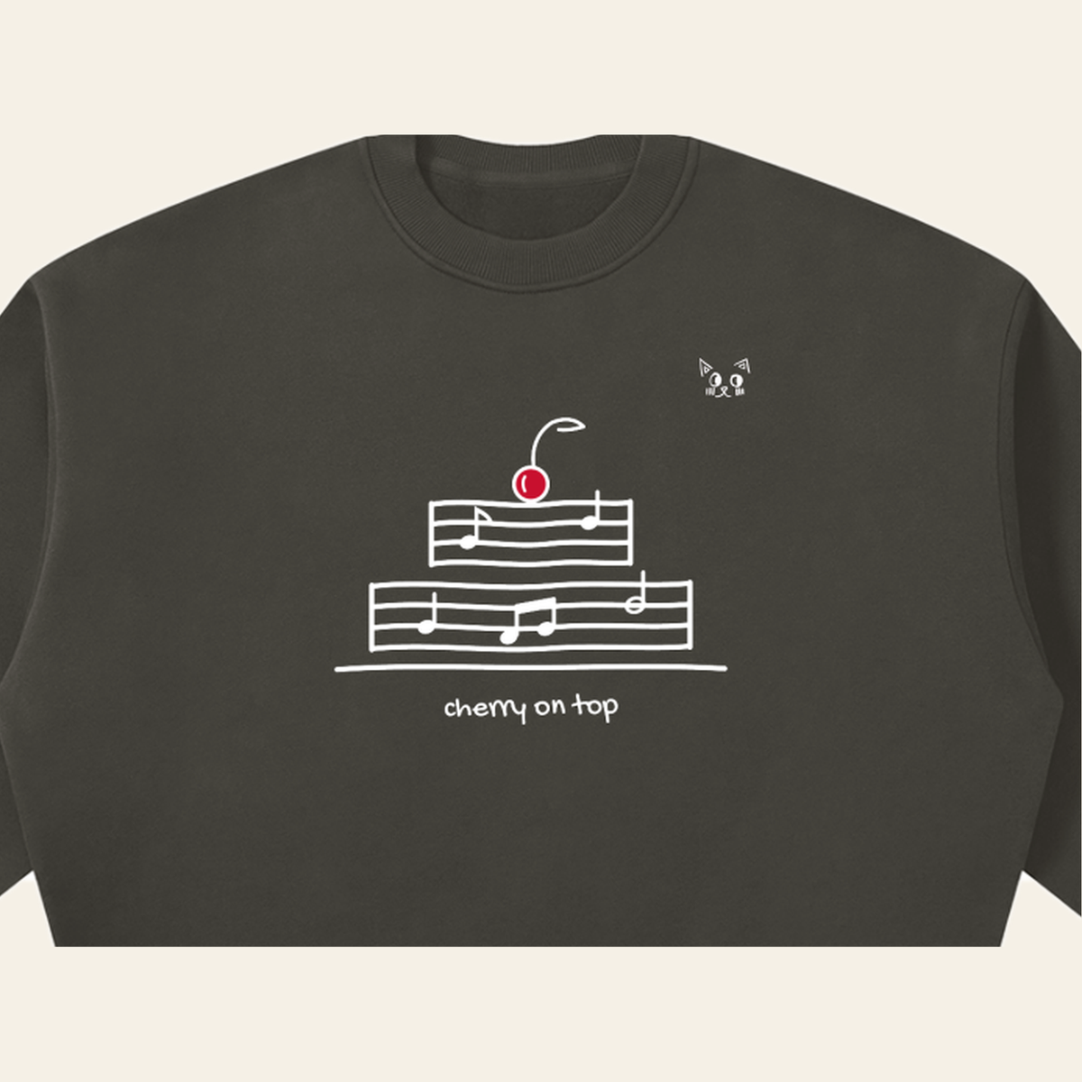 Close-up of the Cherry on Top mark printed on the Dark Gray sweatshirt