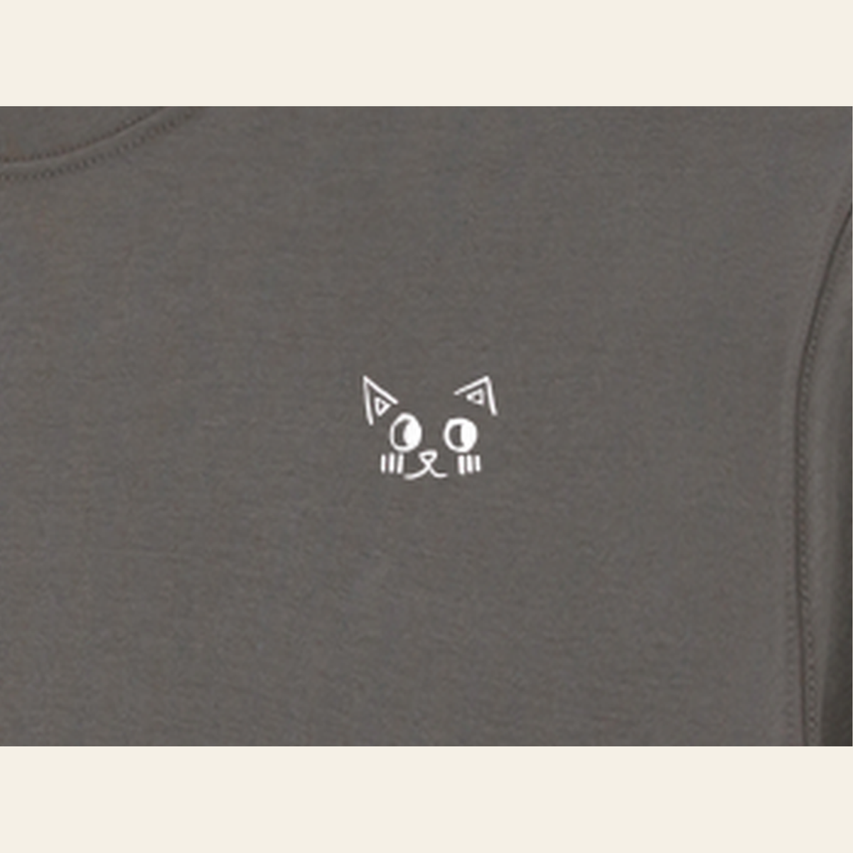 Close-up of the Batce mark printed on the Dark Gray long-sleeve t-shirt