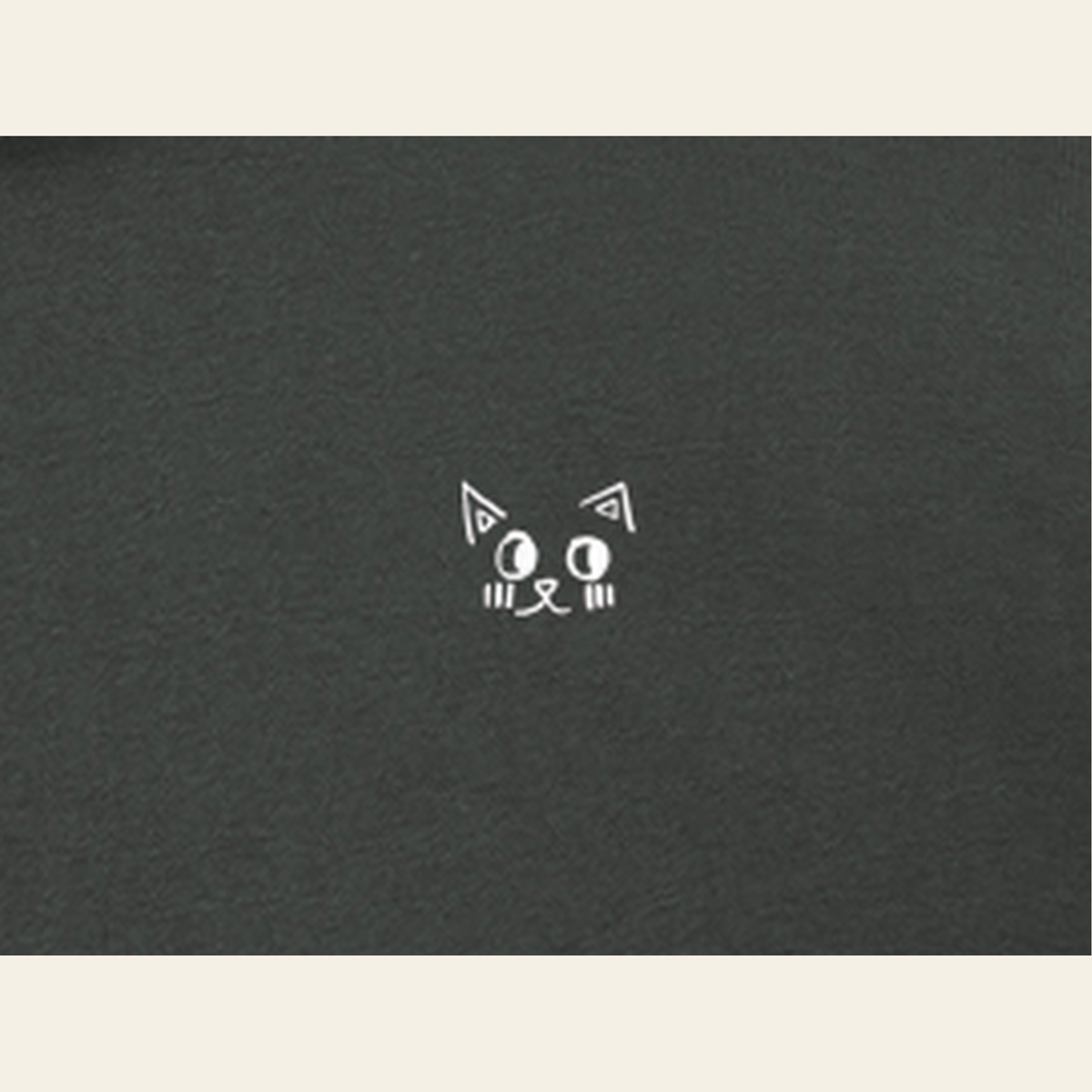 Close-up of the Just Right mark printed on the Dark Gray zip hoodie