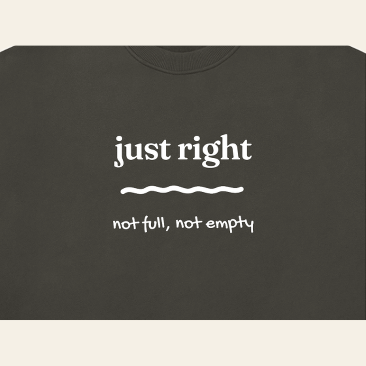 Close-up of the Just Right mark printed on the Dark Gray sweatshirt