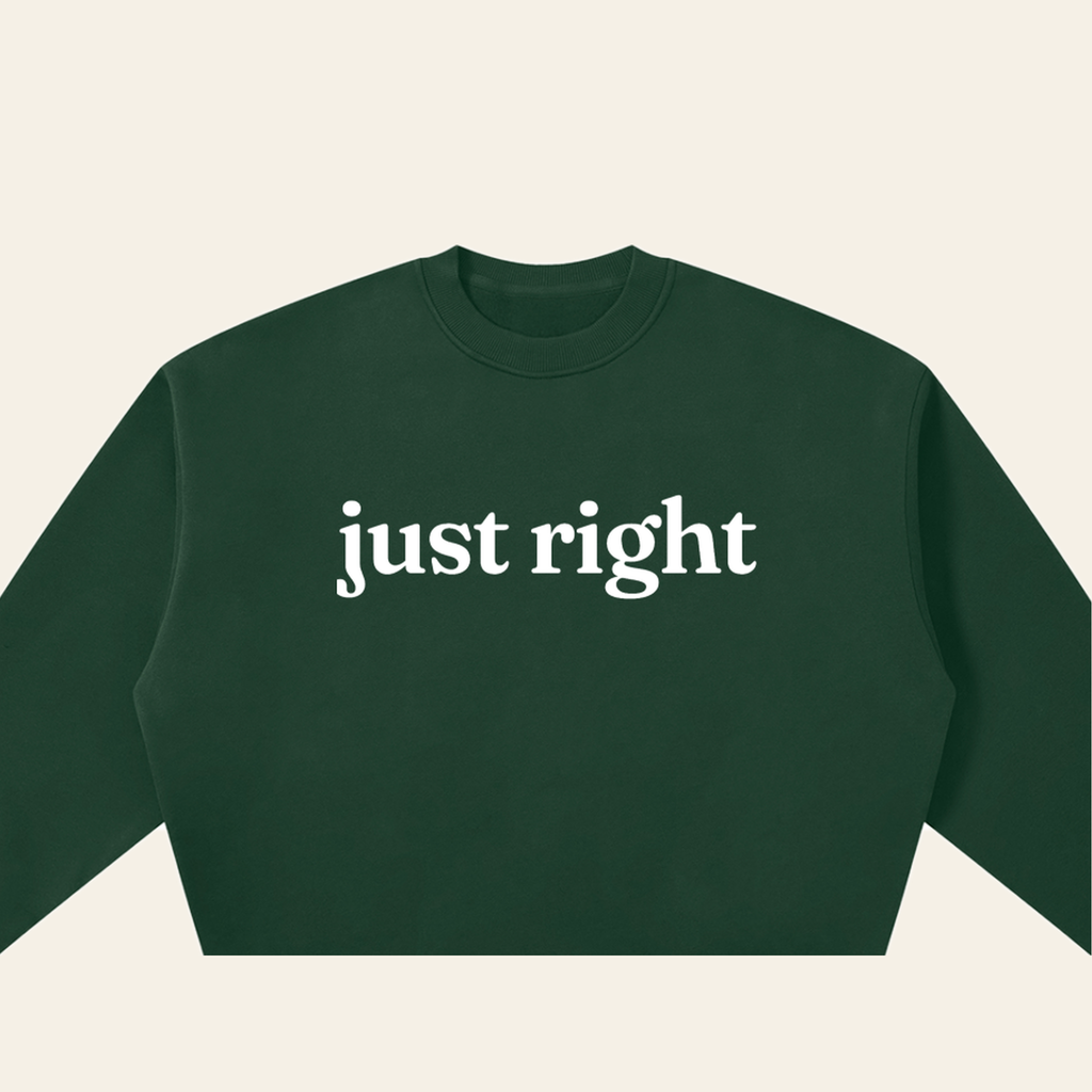 Close-up of the Just Right mark printed on the Dark Green sweatshirt