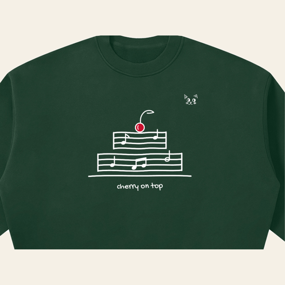 Close-up of the Cherry on Top mark printed on the Dark Green sweatshirt