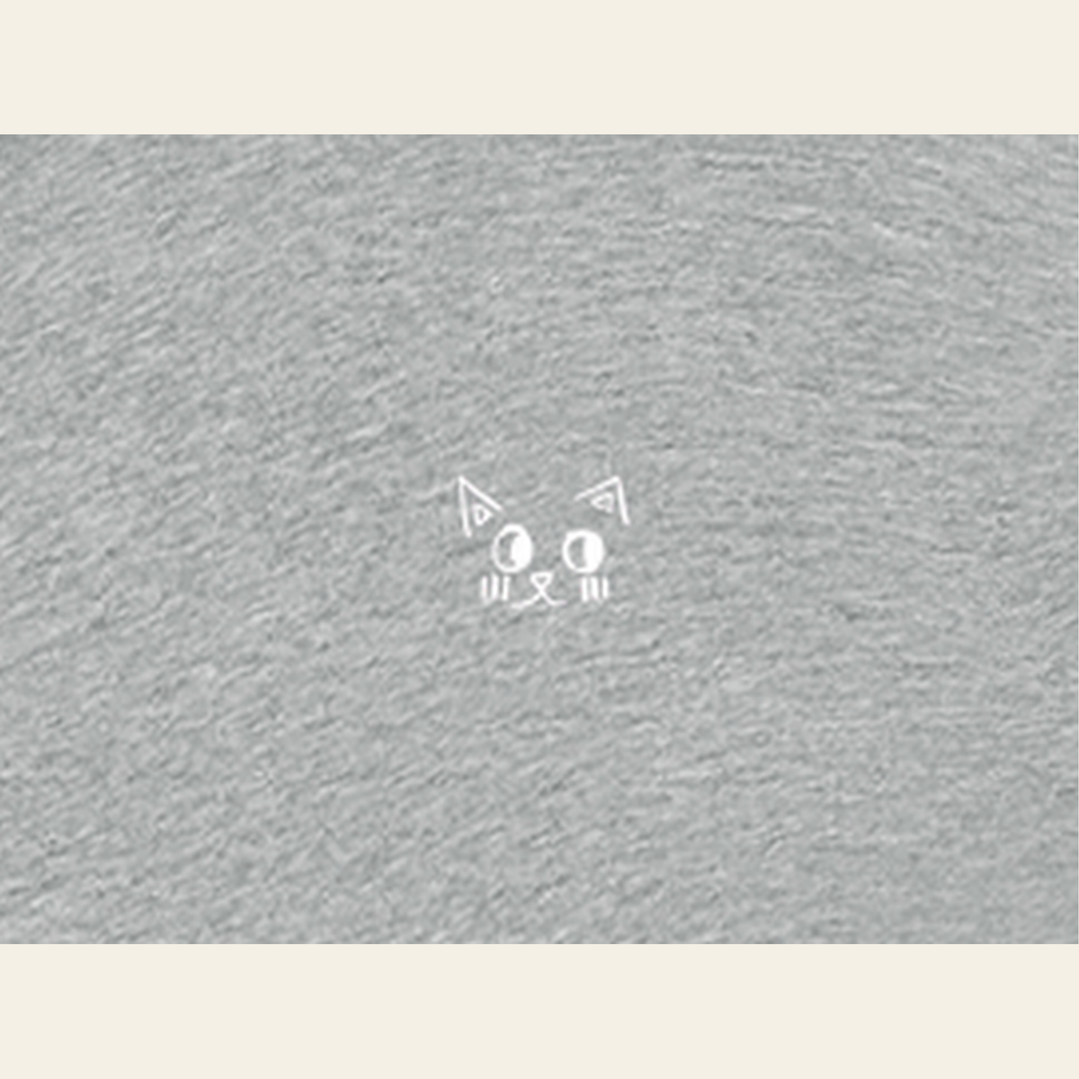 Close-up of the Just Right mark printed on the Heather Gray zip hoodie