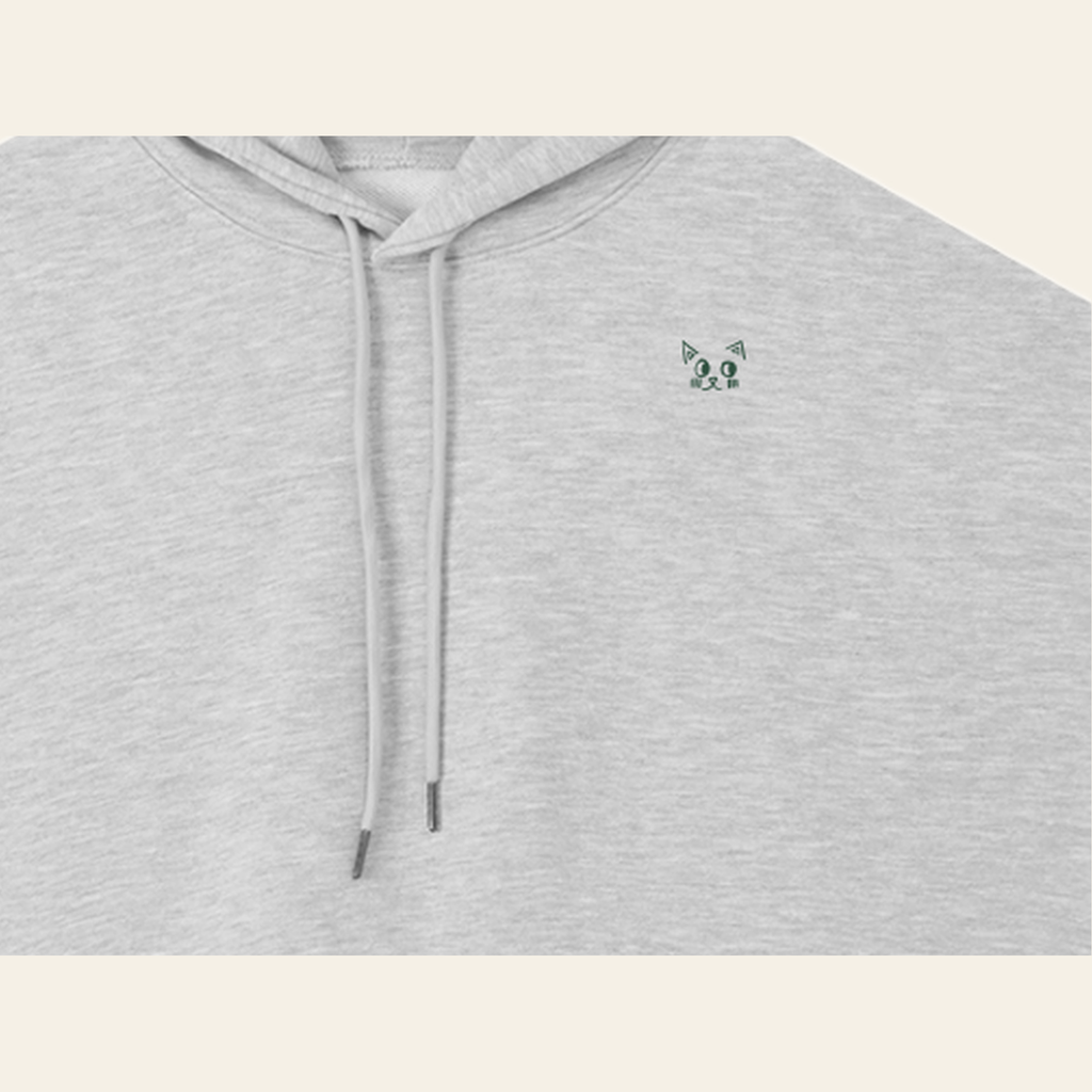 Close-up of the Batce mark printed on the Heather Gray hoodie