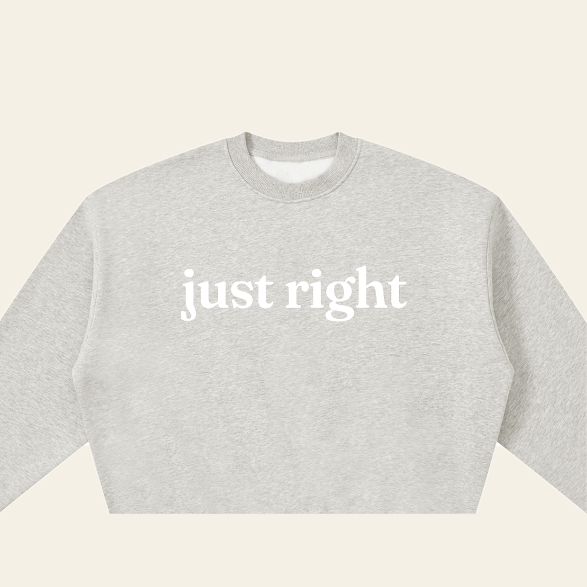 Close-up of the Just Right mark printed on the Heather Gray sweatshirt