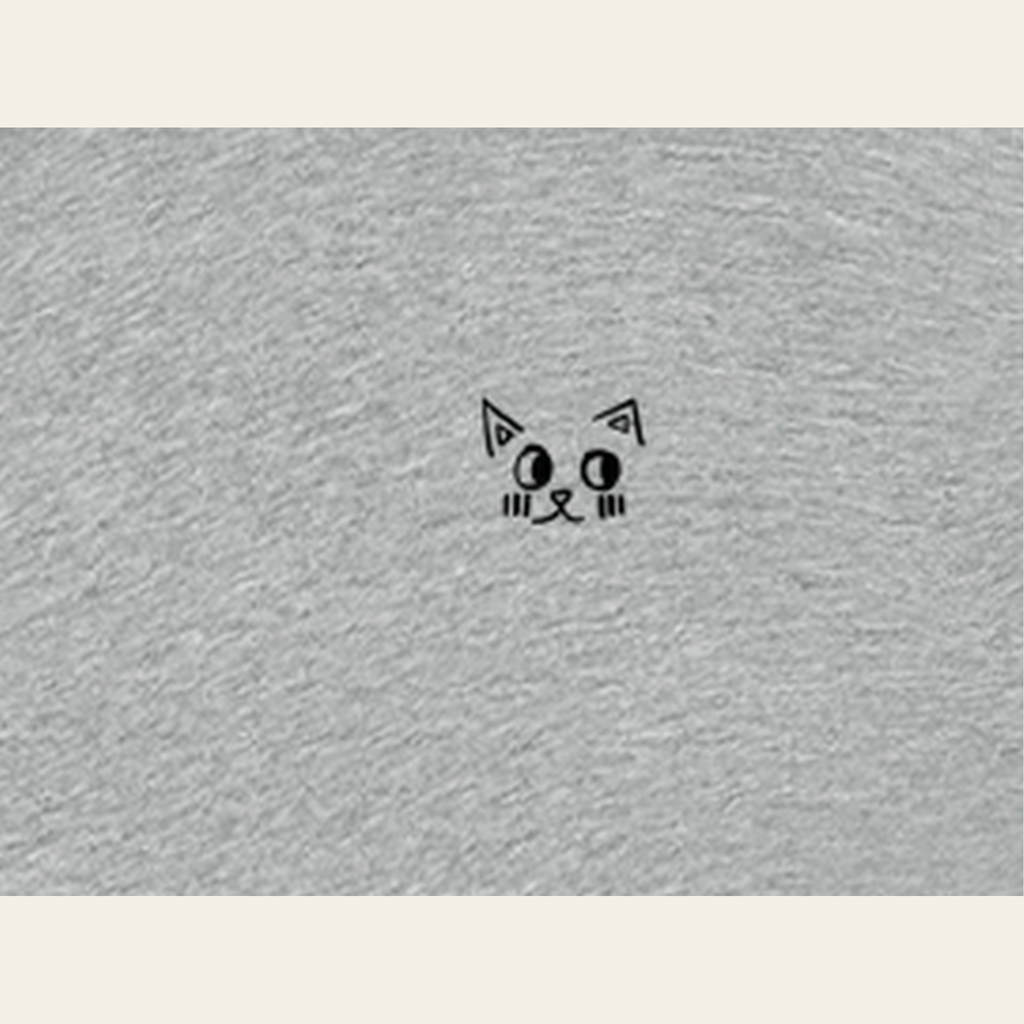 Close-up of the Just Right mark printed on the Heather Gray zip hoodie