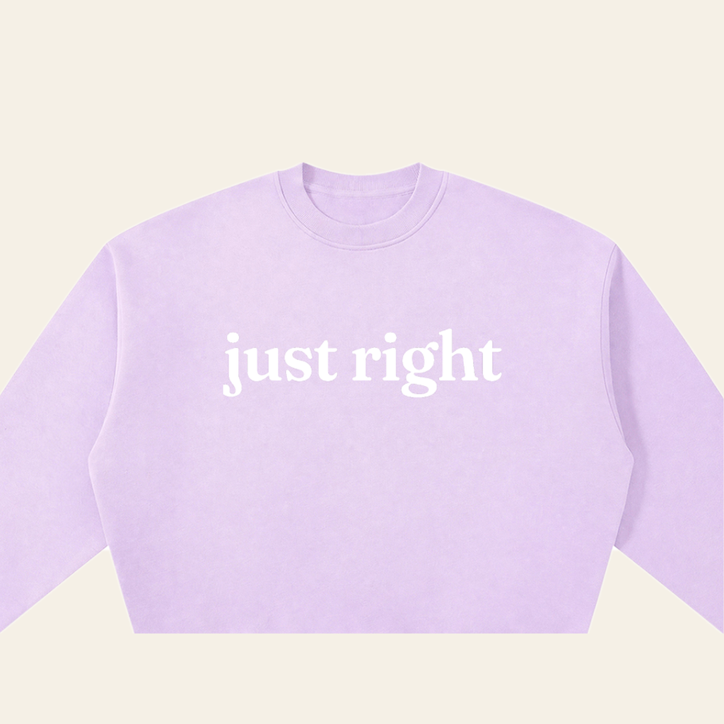 Close-up of the Just Right mark printed on the Lavender sweatshirt