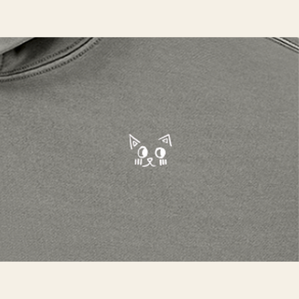 Close-up of the Batce mark printed on the Light Gray hoodie
