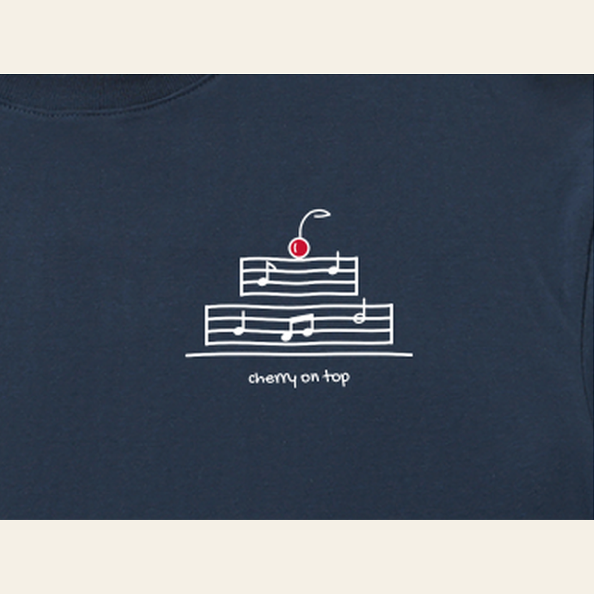 Close-up of the Cherry on Top mark printed on the Navy Blue long-sleeve t-shirt