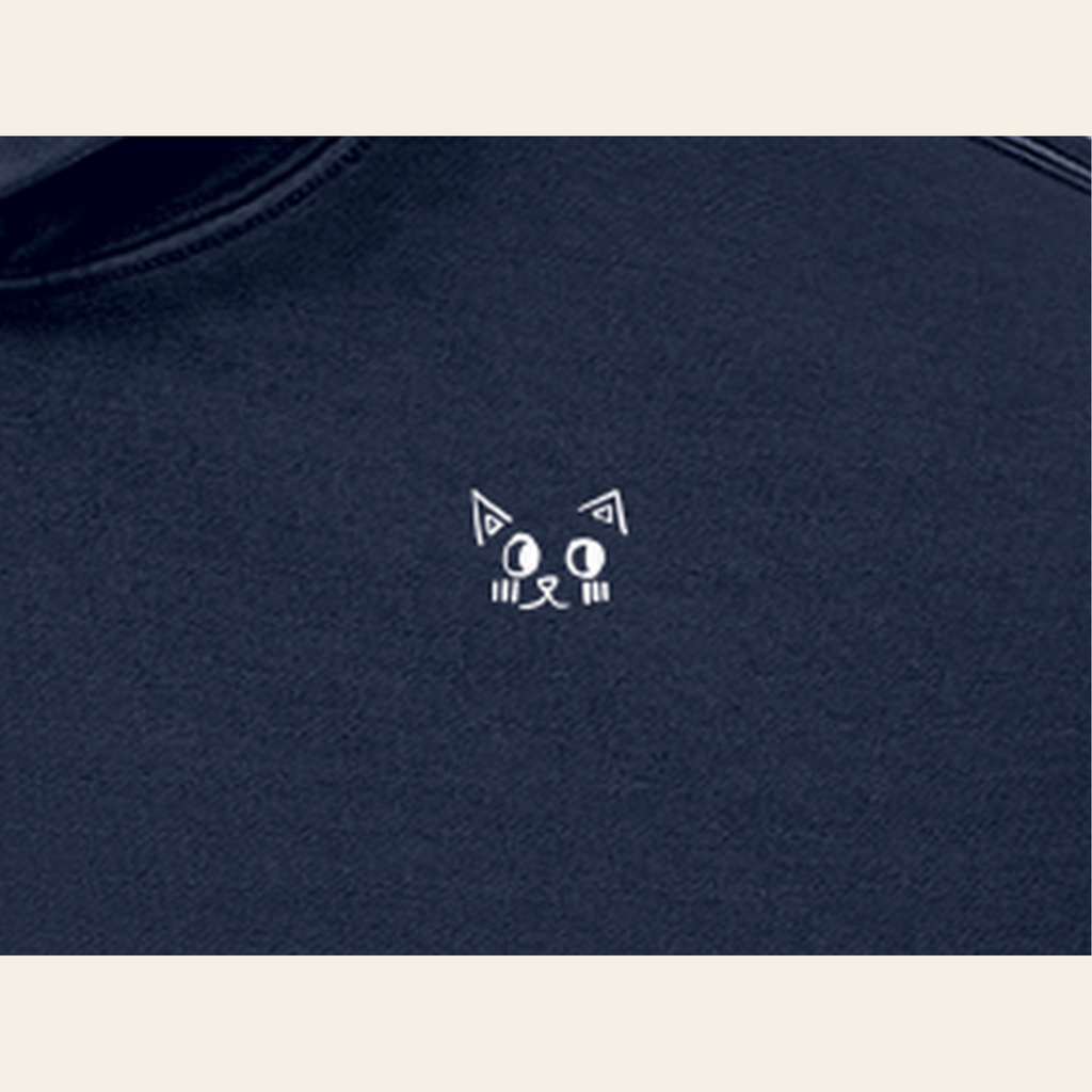 Close-up of the Batce mark printed on the Navy Blue hoodie