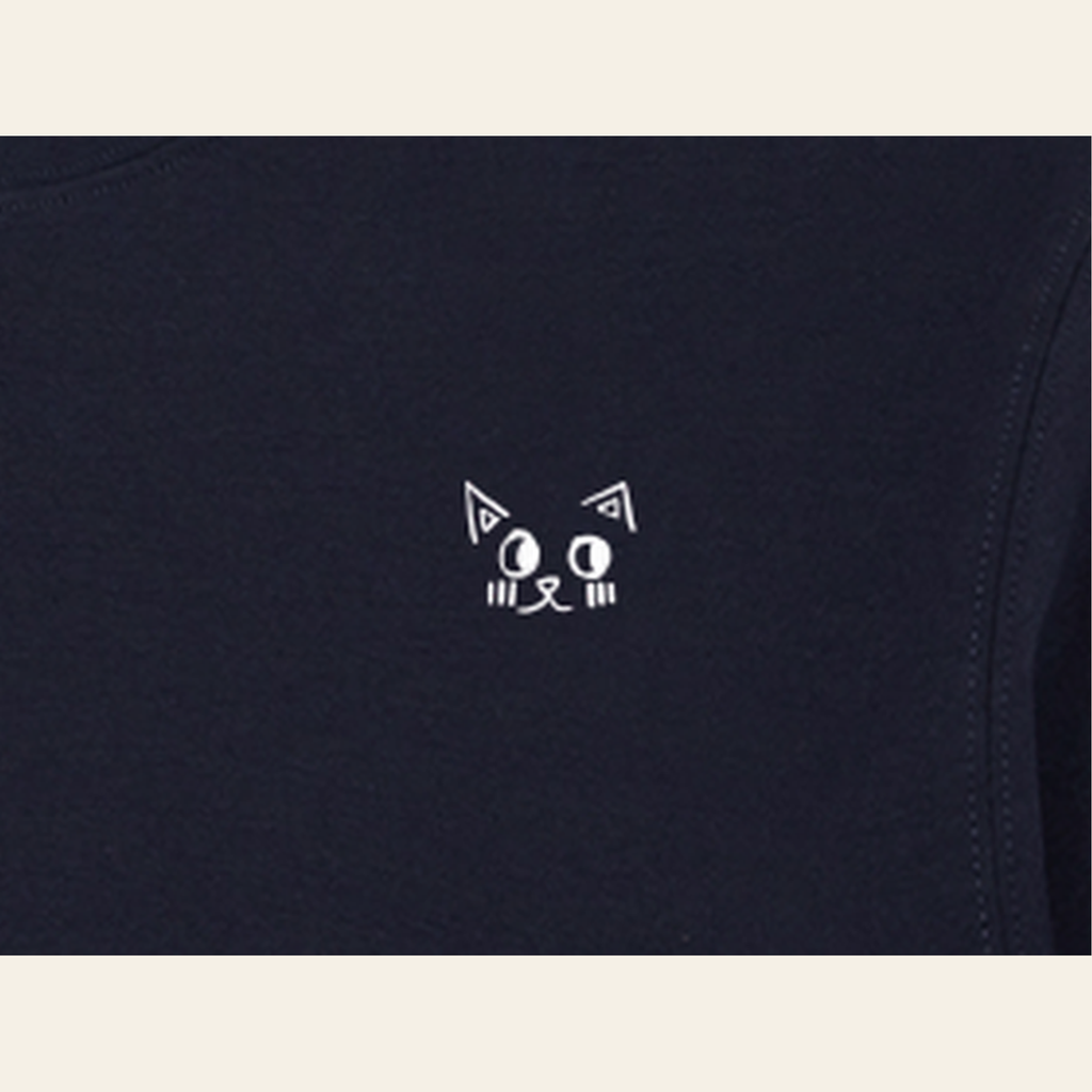 Close-up of the Batce mark printed on the Navy Blue long-sleeve t-shirt