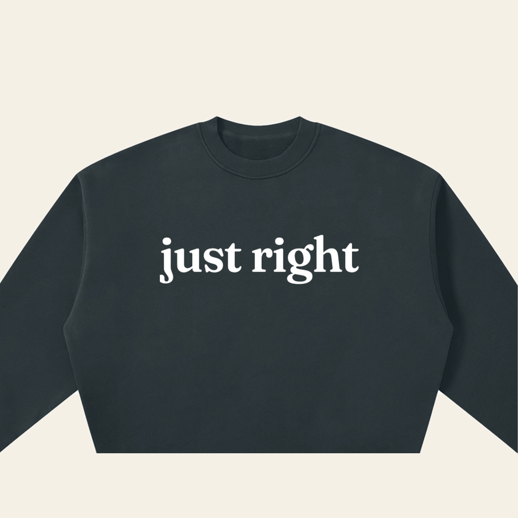 Close-up of the Just Right mark printed on the Navy Blue sweatshirt