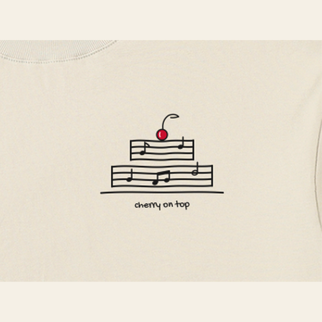 Close-up of the Cherry on Top mark printed on the Peach long-sleeve t-shirt