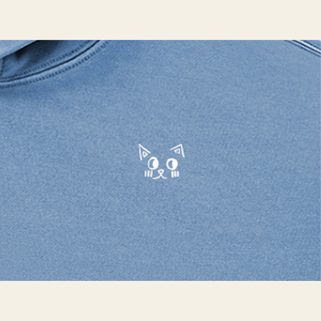 Close-up of the Batce mark printed on the Slate Blue hoodie