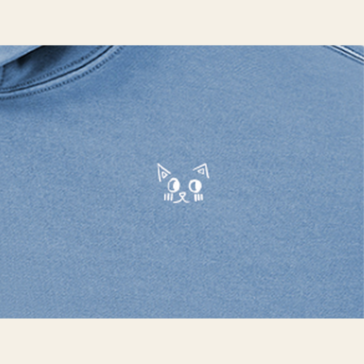 Close-up of the Batce mark printed on the Slate Blue hoodie