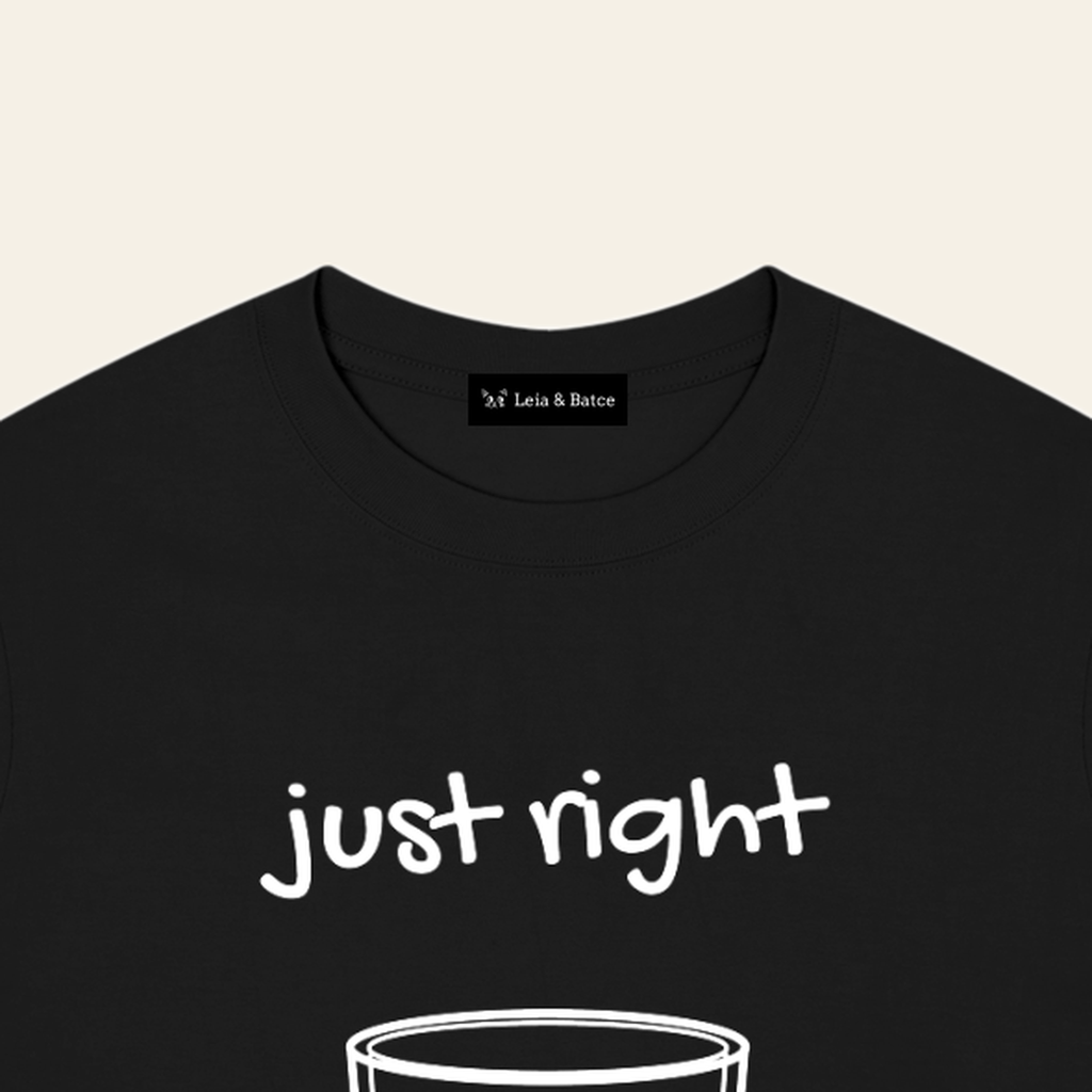The Leia & Batce label sewn inside the back collar of the Black adult t-shirt