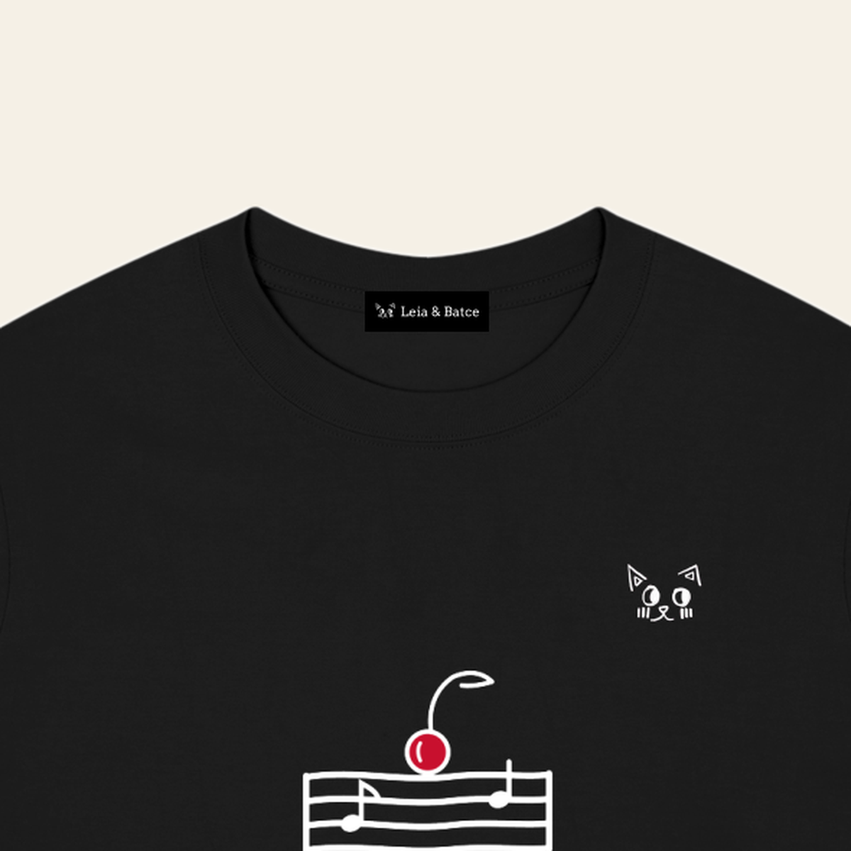 The Leia & Batce label sewn inside the back collar of the Black adult t-shirt