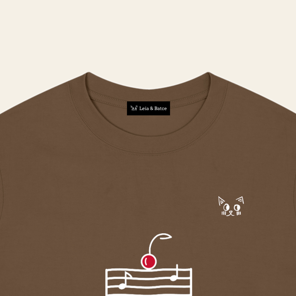 The Leia & Batce label sewn inside the back collar of the Brown adult t-shirt