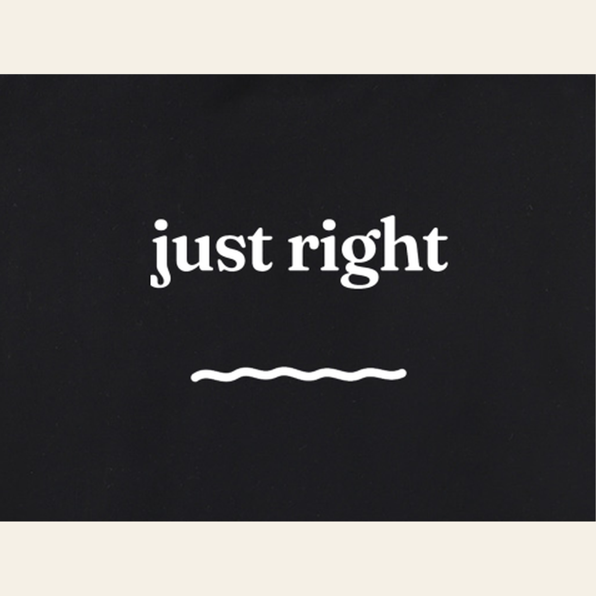 Close-up of the Just Right print on the back of the Black sweatshirt