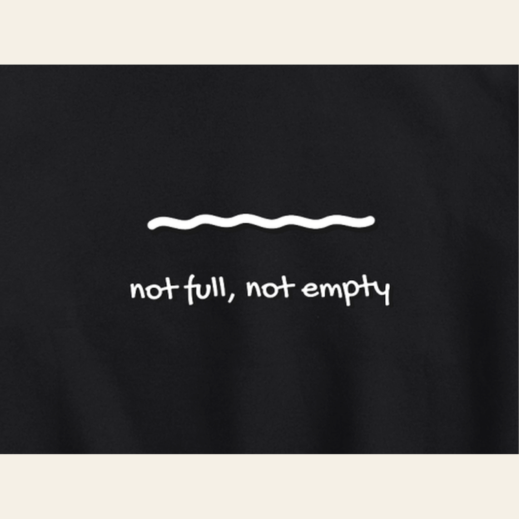 Close-up of the Just Right print on the back of the Black hoodie