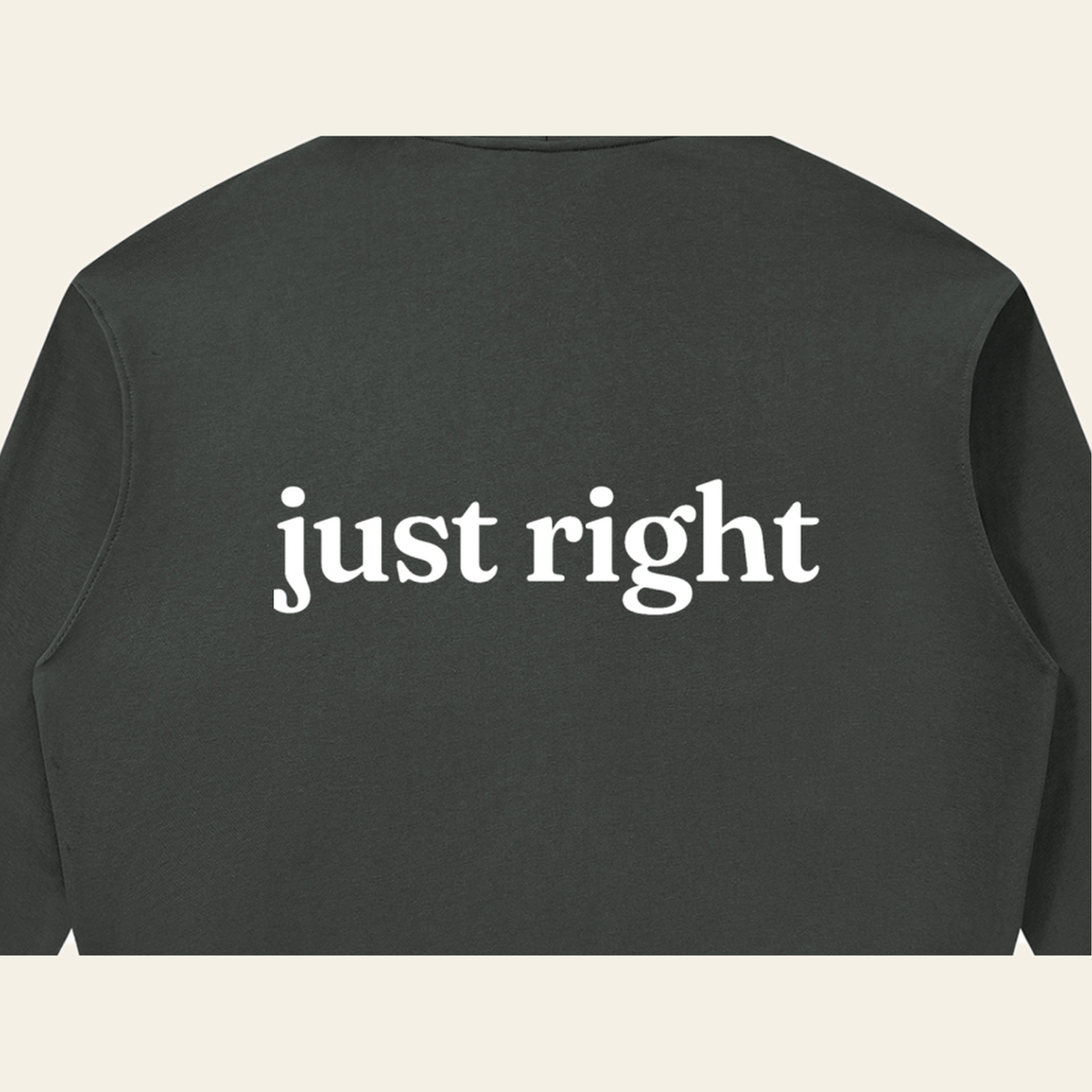 Close-up of the Just Right print on the back of the Dark Gray zip hoodie