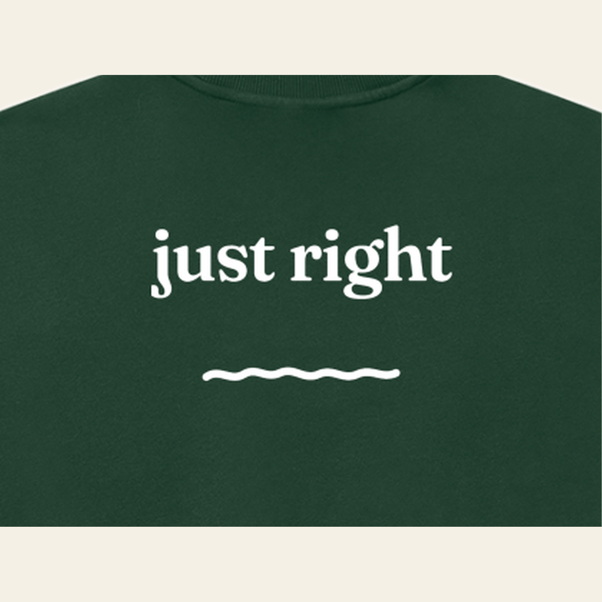 Close-up of the Just Right print on the back of the Dark Green sweatshirt