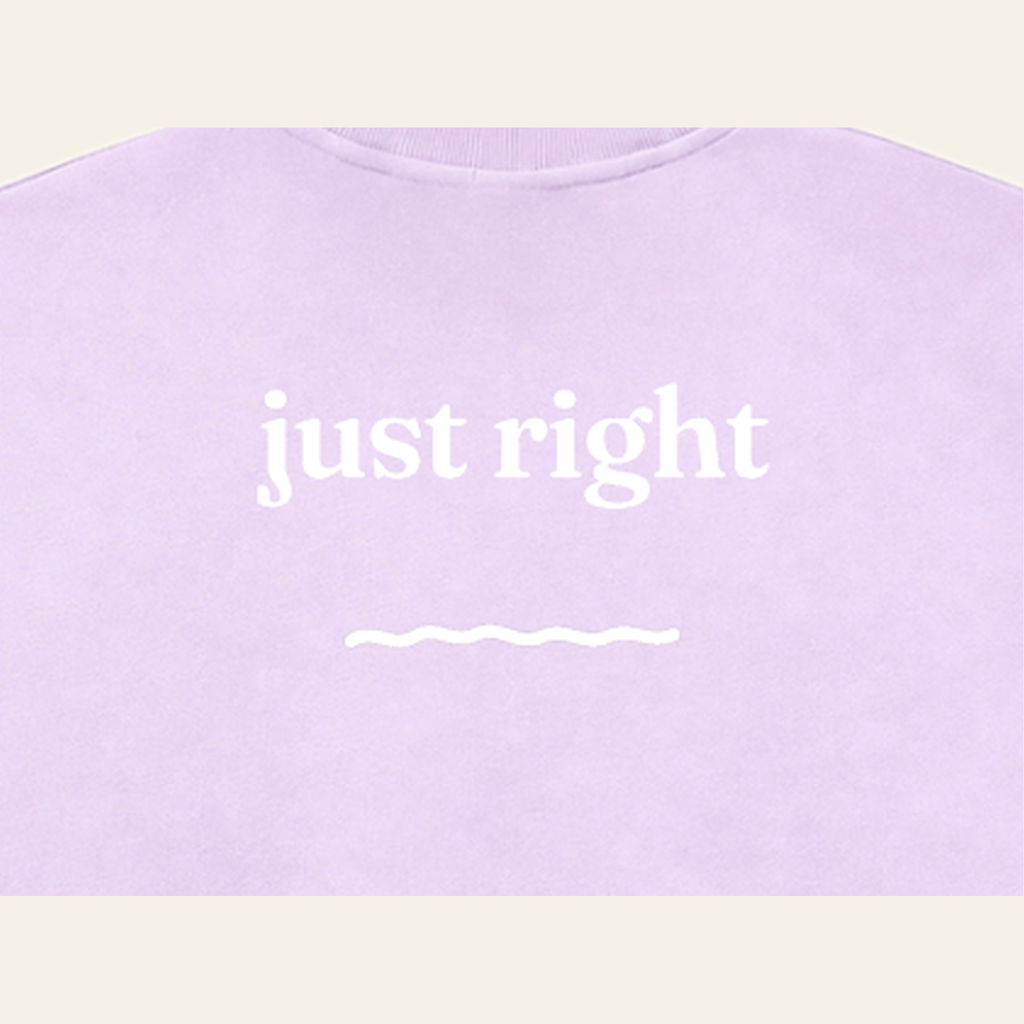 Close-up of the Just Right print on the back of the Lavender sweatshirt