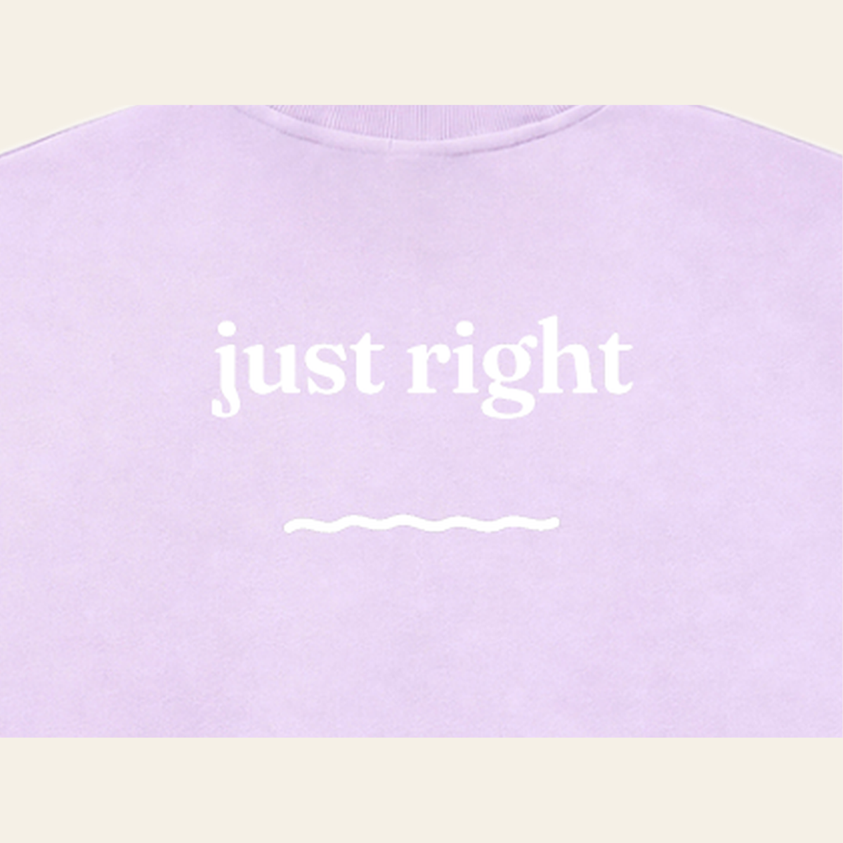 Close-up of the Just Right print on the back of the Lavender sweatshirt