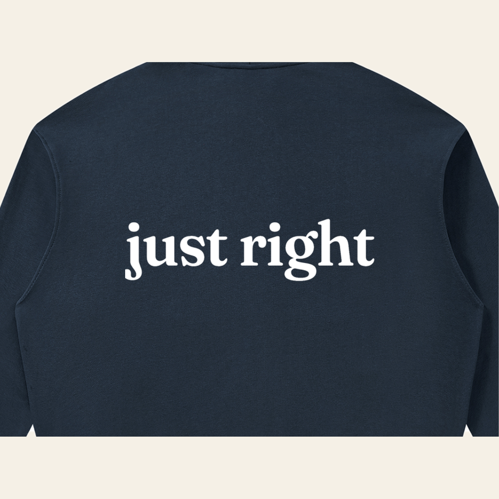 Close-up of the Just Right print on the back of the Navy Blue zip hoodie