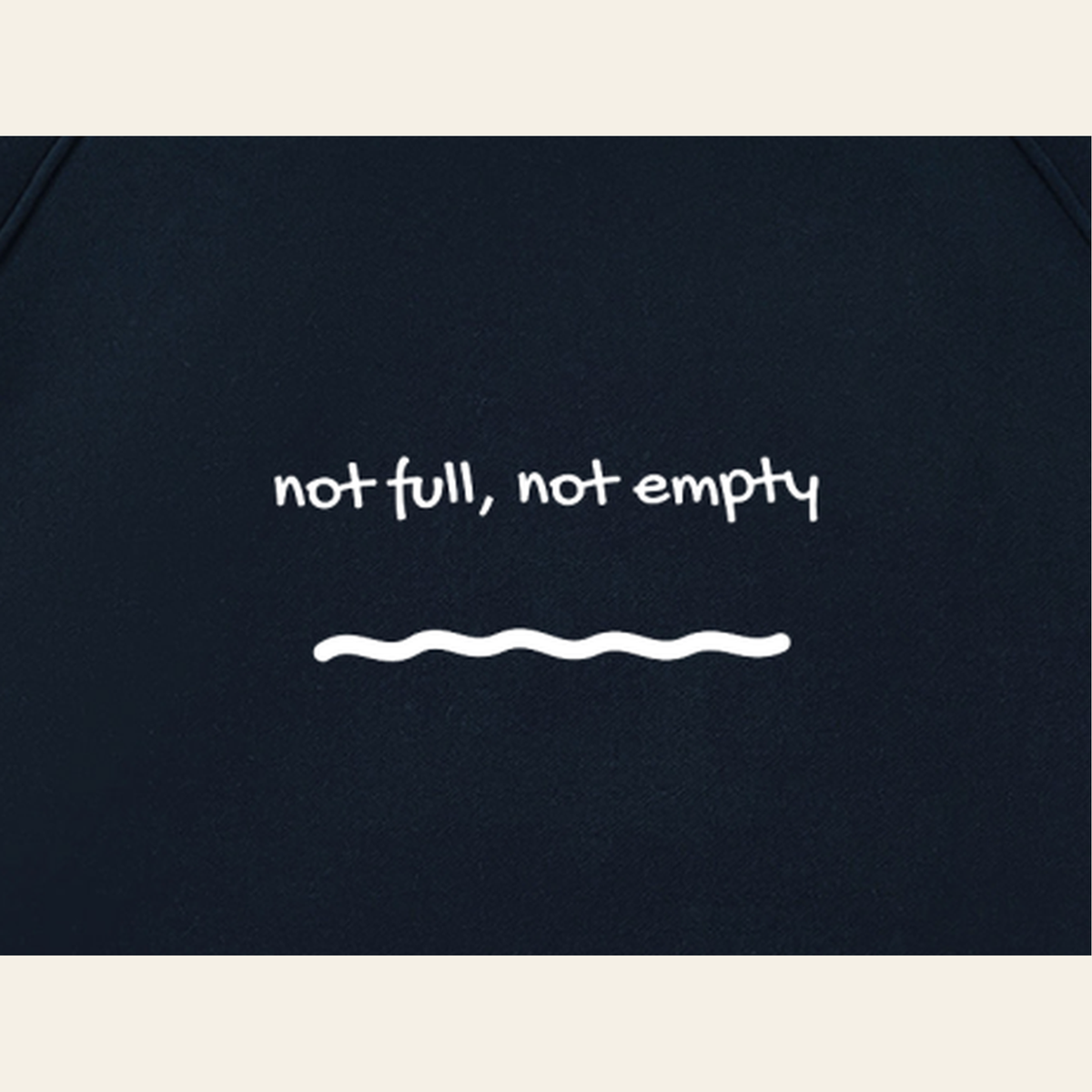 Close-up of the Just Right print on the back of the Navy / Oatmeal hoodie